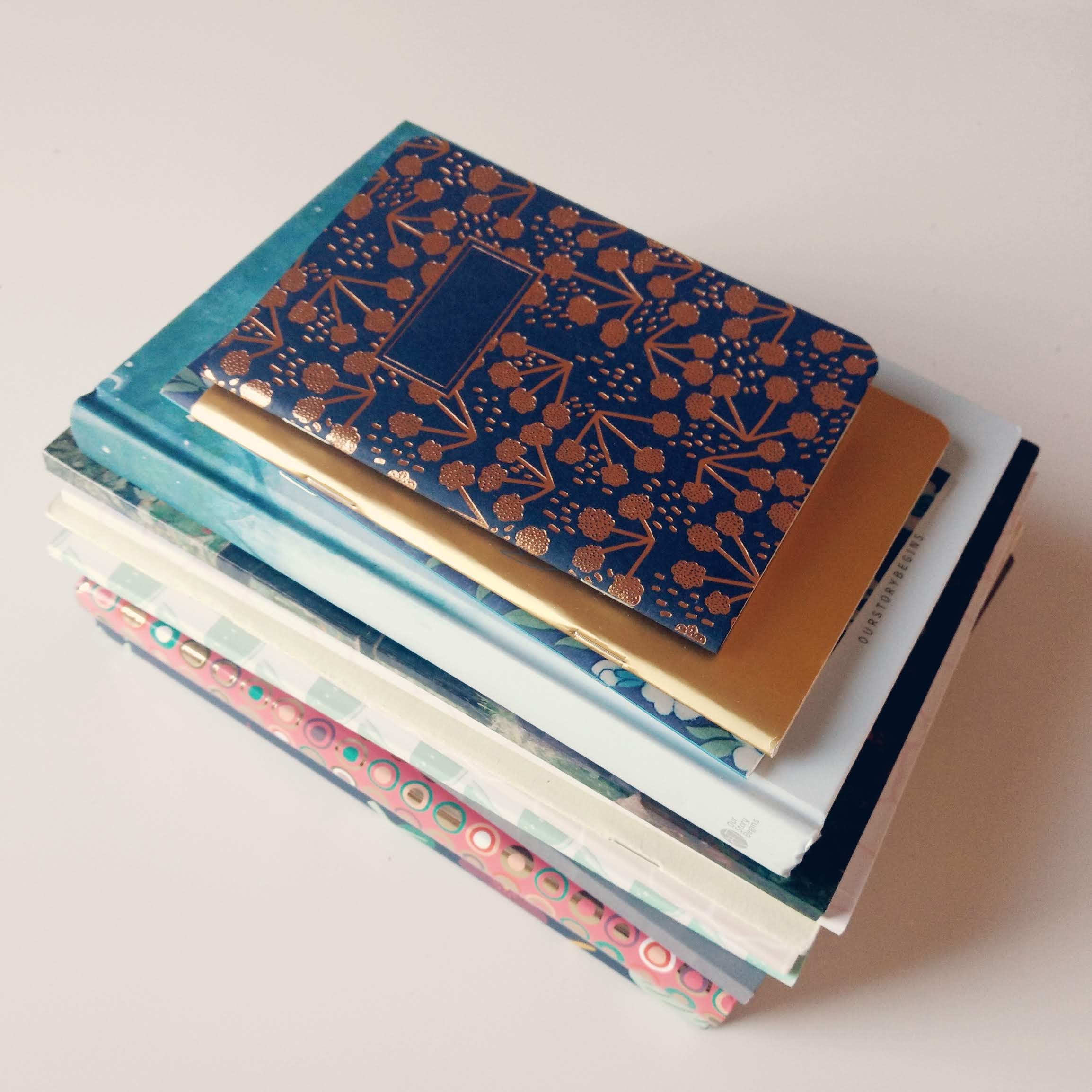 A stack of pretty notebooks.